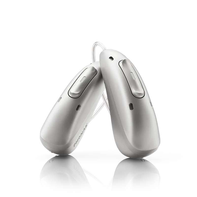 A pair of Phonak Audéo Infinio Ultra receiver-in-canal hearing aids in silver grey