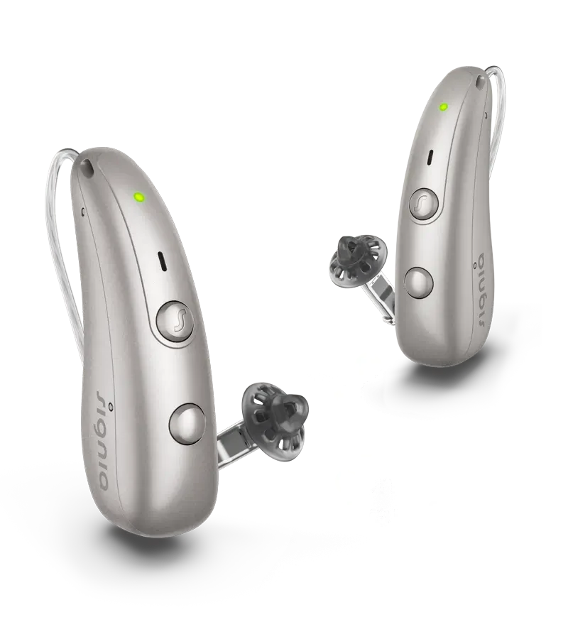 A pair of Signia Pure Charge&Go IX hearing aids in dark champagne