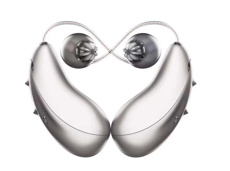 A pair of Unitron Moxi S-RX receiver-in-canal hearing aids in platinum