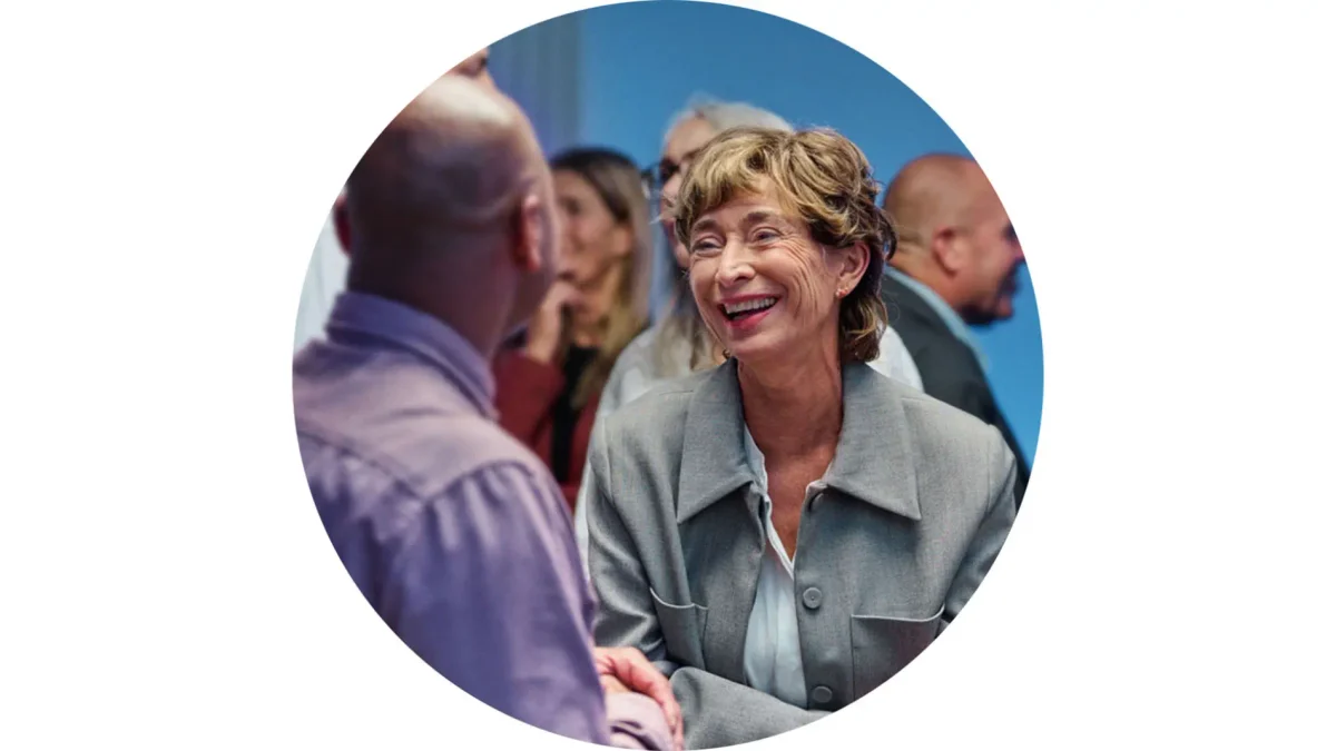 A woman following a lively group conversation with ease